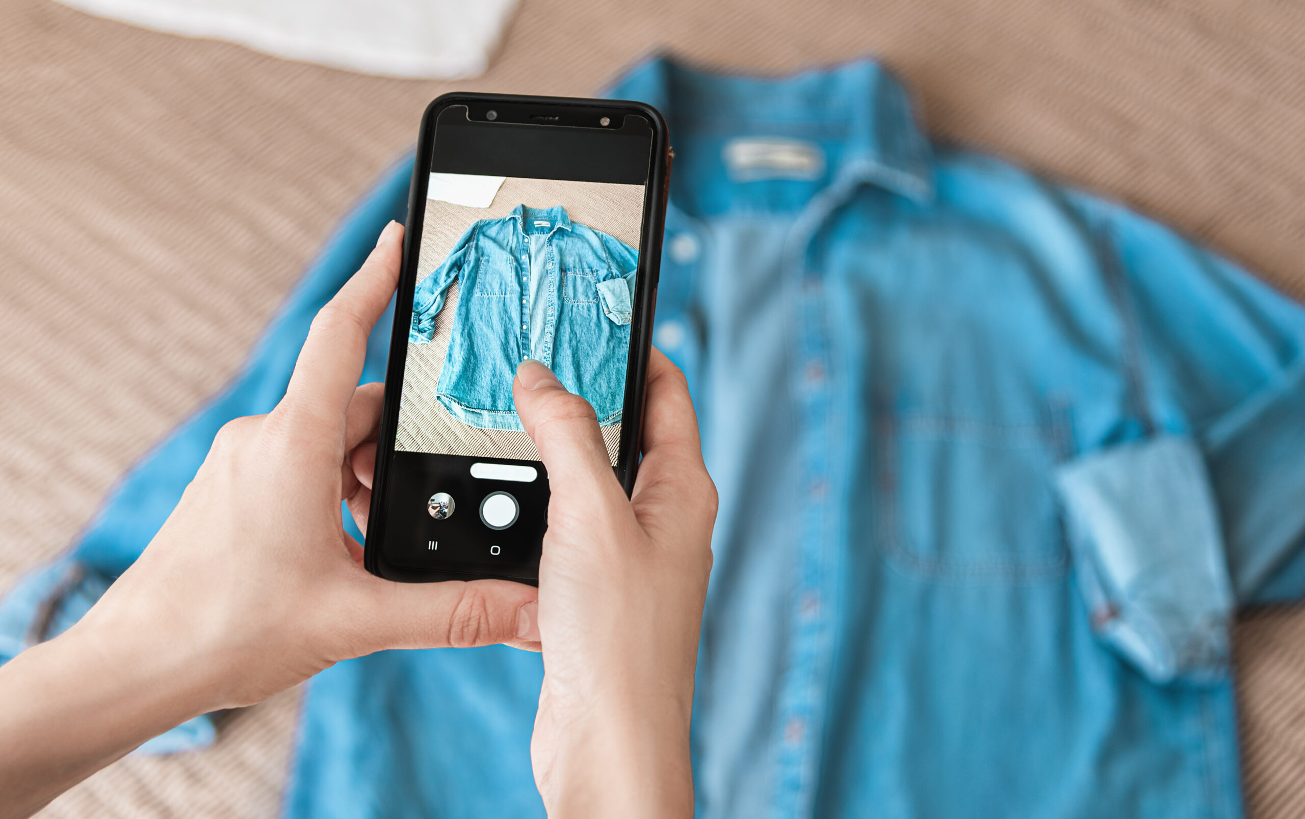 Woman,Taking,Photo,Of,Denim,Shirt,On,Smartphone